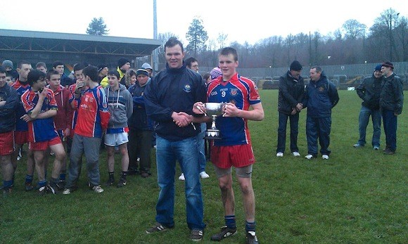 Carrick captain Paddy Byrne with the U-16 final trophy