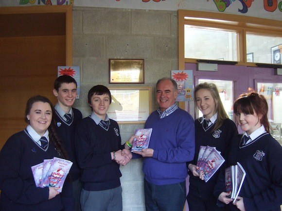 Former guidance counsellor at Mulroy College, Fergus Friel, gets the first copy of the recipe book.