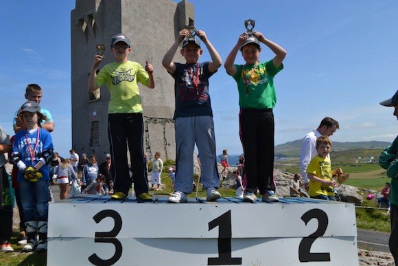 Junior 100 run what you brung homemade class 8 - 12 years 1st joseph doherty 2nd Stephanie Doherty 3rd niall Gallagher — at Malin Head Soap box Derby.