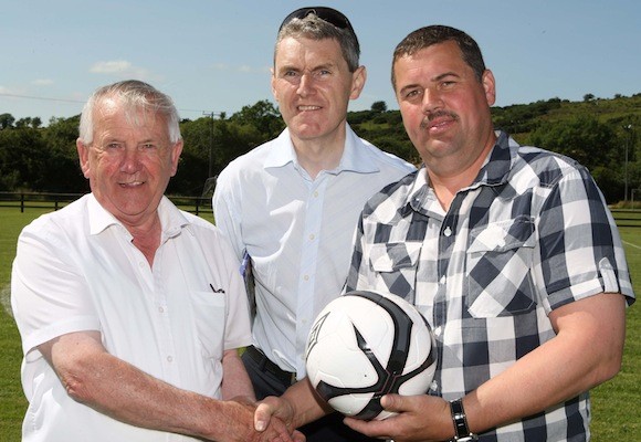 Robert Johnston of Green Valley Foods pictured presentig the match ball to Joe Duffy former Donegal League Chairman who was a guest at the Copany Rovers 25th Anniversary celebrations on Sunday. Included is Copany Rovers clubman Ian Curristan. Pic.: Gary Foy