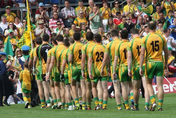 Heading into battle as the Donegal team take part in the pre-match parade. Pic.: Gary Foy