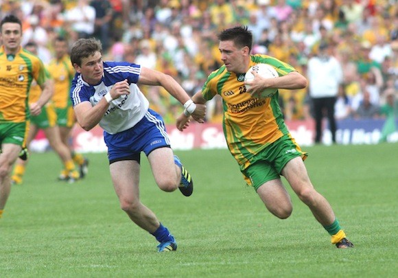 Marty O' Reilly in possession as he tries to shrug off the attention of Monaghan's Dessie Mone. Pic.: Gary Foy