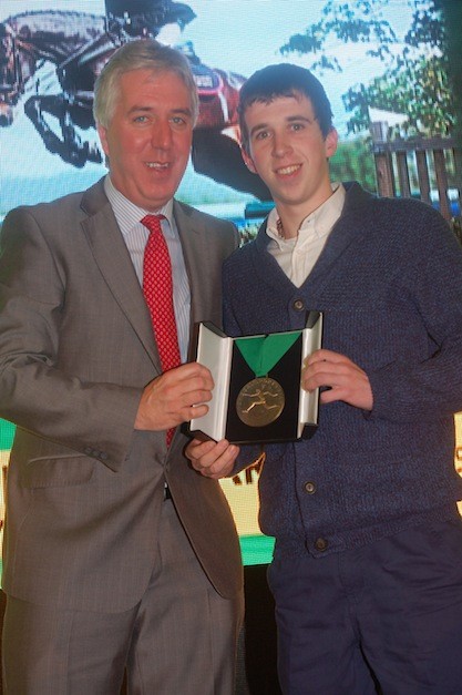 Kenneth Graham receives his award in the equestrian category.