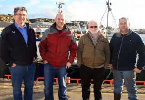 Meeting with Burtonport fishermen Independent TD Thomas Pringle and county council election candidate Micheál Cholm Mac Giolla Easbuig met with fishermen in Burtonport on Monday. Both men spoke to a number of fishermen on issues affecting their industry here and at other harbours throughout the county and found the discussion very informative and productive. Thomas Pringle and Micheál Cholm Mac Giolla Easbuig have campaign offices at Green’s Corner in Dungloe. Also in the photo Hugh Boyle and Frankie Gallagher